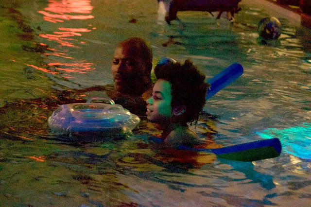 Man and boy in a pool
