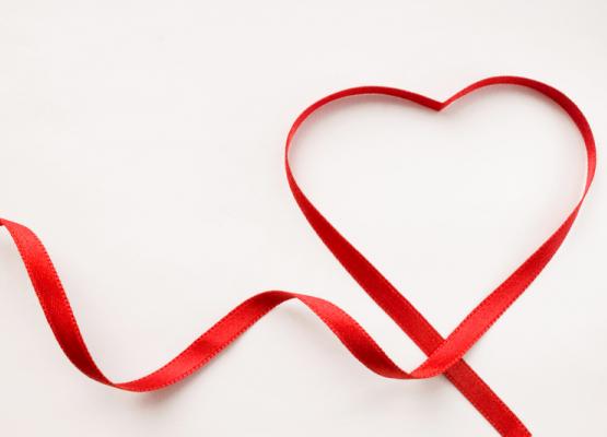 Red ribbon shaped in a heart