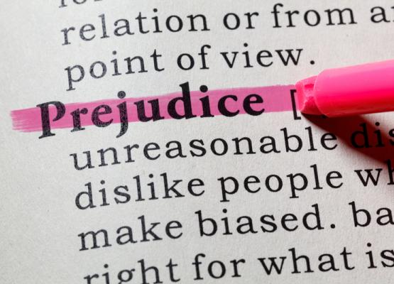The word prejudice highlighted in a dictionary