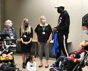 Pascal Siakam and Holland Bloorview clients during visit to hospital