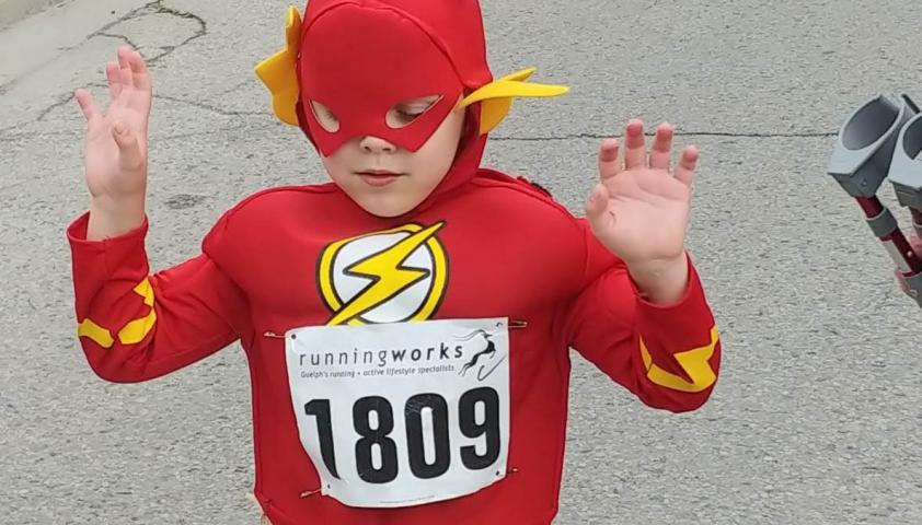 Alex wearing his Flash costume