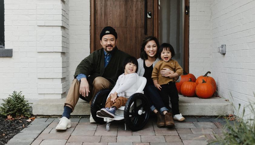 Lam family on porch on Halloween.