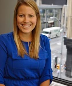 Young woman with blond hair and blue shirt