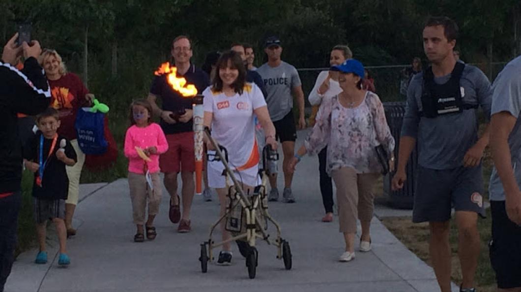 Our very own Nydia Langill lights Parapan Am torch