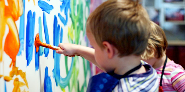 Little children painting a mural Little children painting a mural