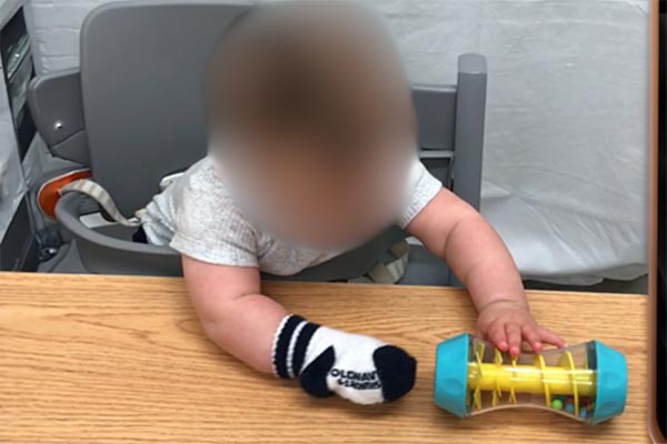 Fill a water bottle with toys and food colouring. Have the infant roll the bottle on a flat surface using their helper hand in front of their body. 