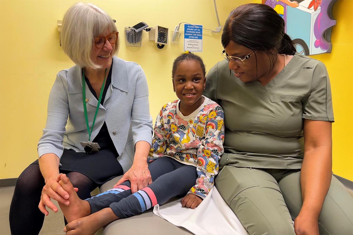 Two adults and a child in a clinic