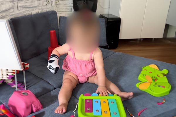 Give toys that do not move. Consider cause and effect toys (e.g., toy that lights up, makes sound, vibrates) to encourage the infant to stabilize the toy on a surface by using their hand (hand can be fisted)  