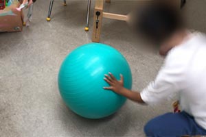 Push a big exercise ball with your hand (hand can be fisted or open).