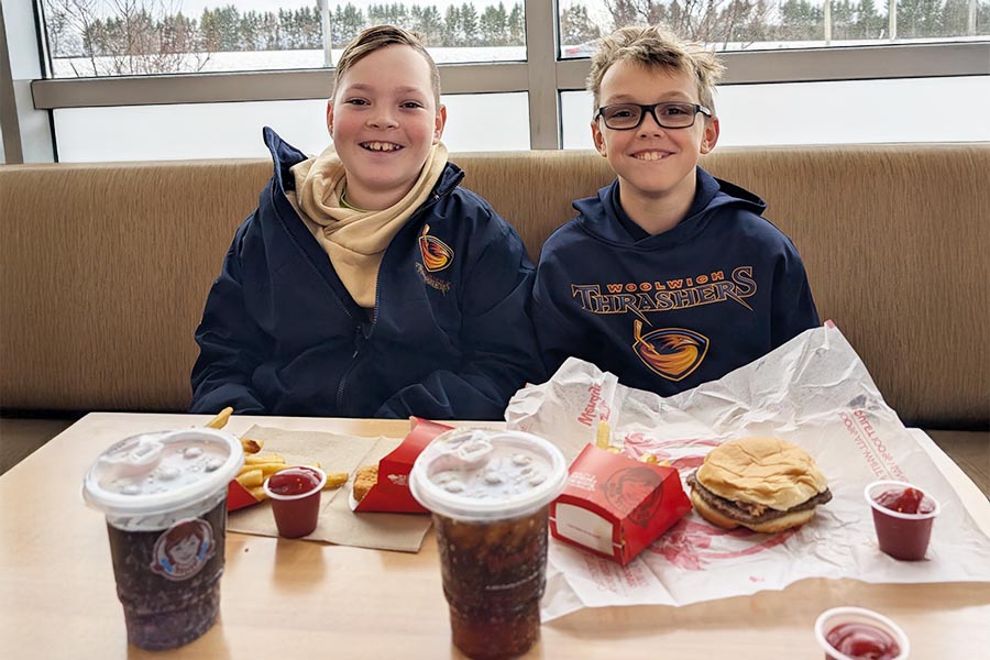 Two children are enjoying some fast food shop at Wendy's