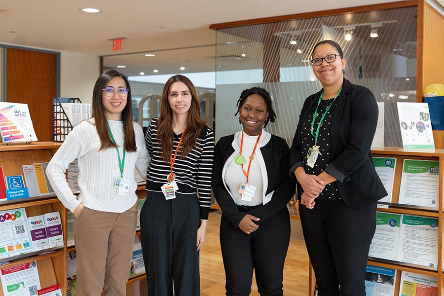 Four people in a library