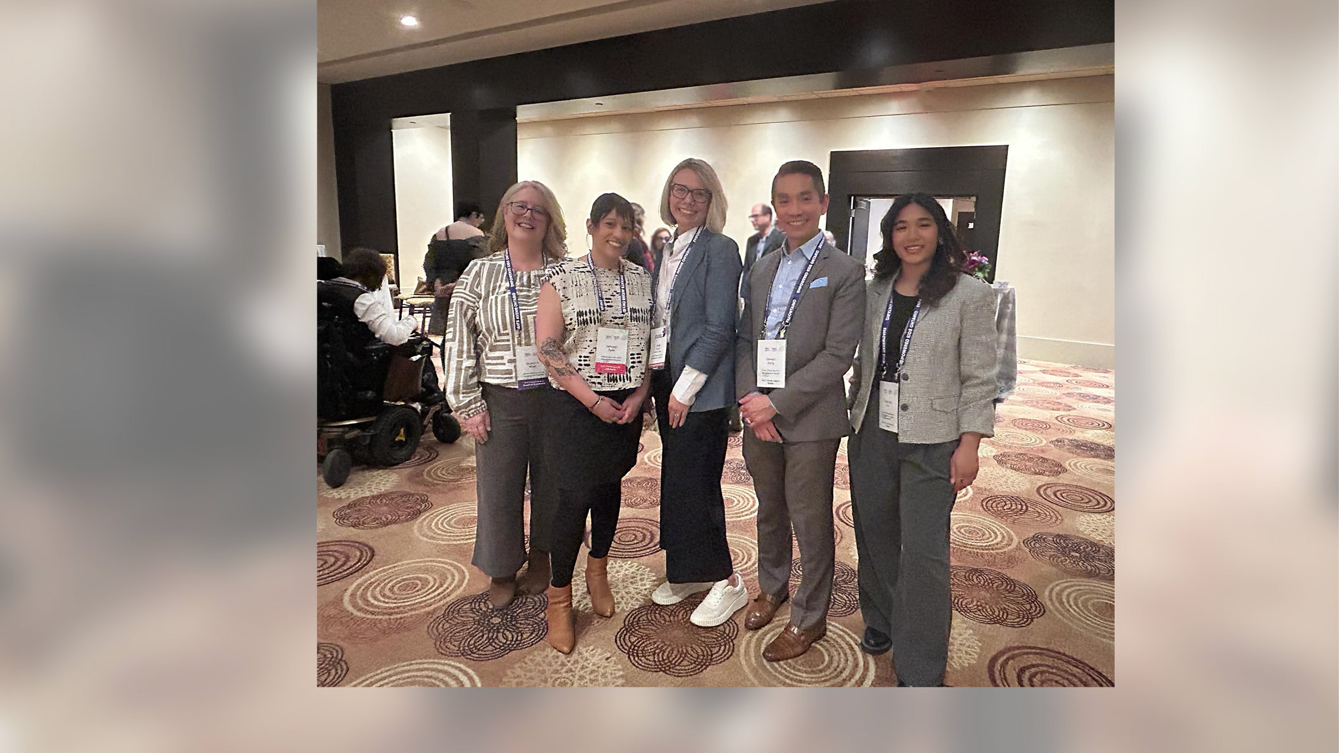 group of people standing in room