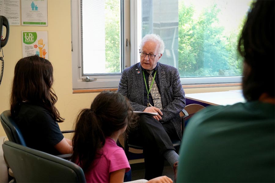 Dr. Rumney meeting with a client and family in the Brain Injury Rehab clinic at Holland Bloorview, 2025.