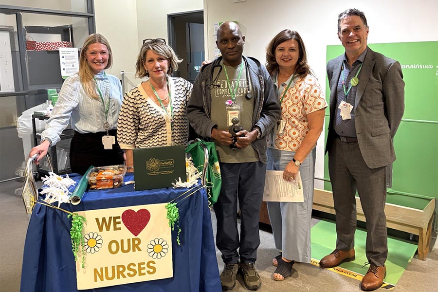 From left: Angela Renkema, Nursing Vision and Strategy Lead; Irene Andress, Vice President, Programs and Services and Chief Nursing Executive; Sid Ramakie, Registered Nurse; Ana DiMambro, Clinical Operations Manager, Collaborative Practice; and Bruce Squires, President and CEO, gather during a Nursing Week celebration. The moment highlights leadership recognition of nursing excellence.