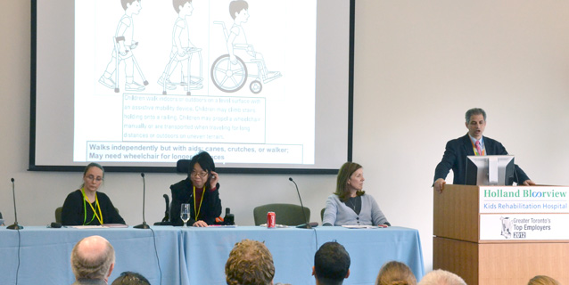 Photo of the panel at the Symposium sitting at a table.