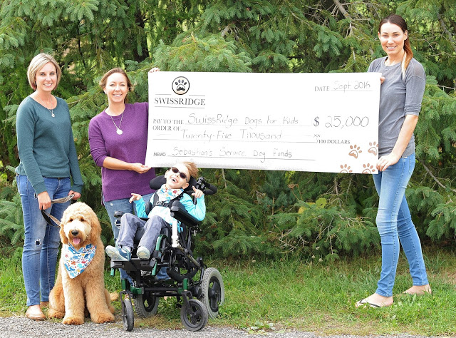 Cheque presented to SwissRidge Dogs for Kids program