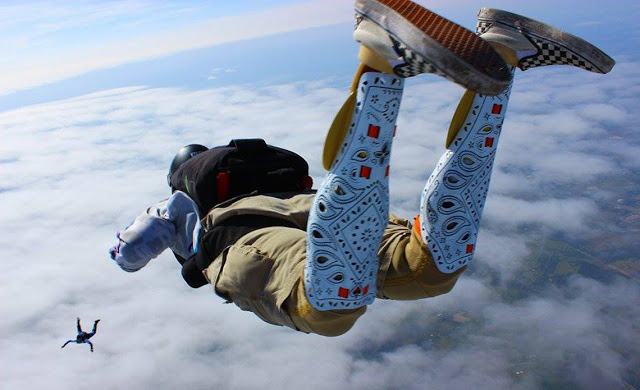 Person skydiving wearing Alleles Prosthetic Covers
