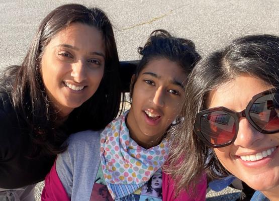 Teen girl and two women smile