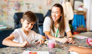 Client and staff engaged in a painting activity