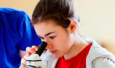 Girl looking in microscope