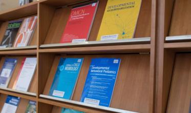 Some books on shelf in a library setting