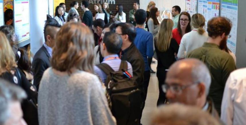 People chatting in the hall during the 13th annual BRI Symposium