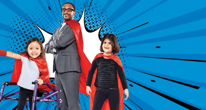 Two young girls and a man all wearing red capes on a blue background