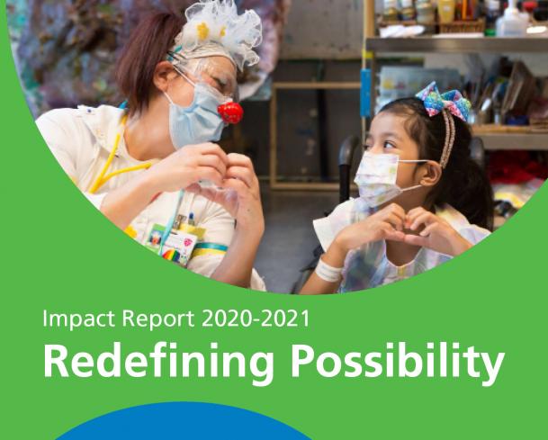 therapeutic clown with a client on the cover of the impact report