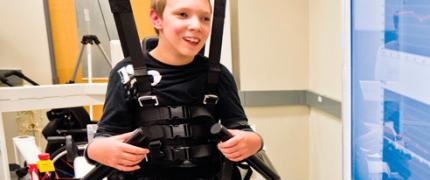 Boy in harness smiling