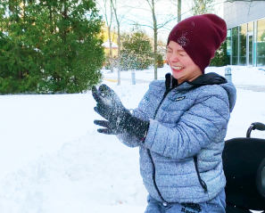 Aly throwing snow in the air.