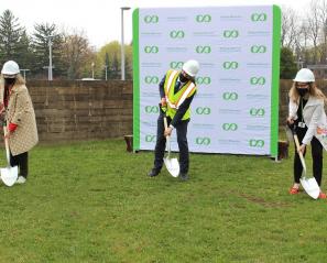 Hospital CEO Julia Hanigsberg poses with VP of Research Tom Chau and Foundation CEO Sandra Hawken for a shovel-in-the-ground photo on the site where the hospital's two-storey addition will be built this month.