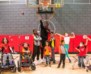Pascal Siakam and Holland Bloorview kids in the gym playing basketball