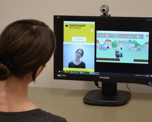 Fanny Hotze, a pediatric assistive technology specialist in the PRISM Lab tests the SwitchApp technology