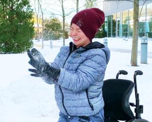 Aly throwing snow in the air.