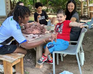 A group of people playing at an outdoor setting