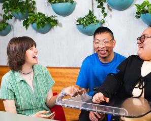 Three people chatting