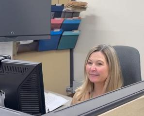 Sharon Ouellette at her desk