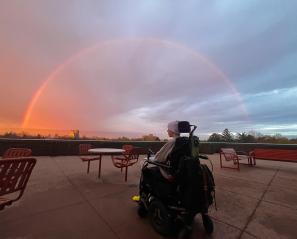 Henry Black on wheelchair looking at the sunset