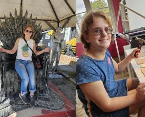 Woman sitting in ancient chair with spikes and at a drawing board holding a hammer
