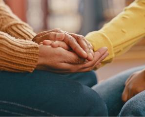 Some hands holding each other