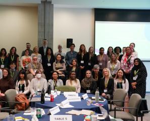group of adults - family leaders, researchers and staff in a conference room