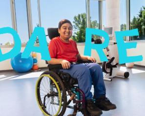 A teenager on a wheelchair, with the word "DARE"