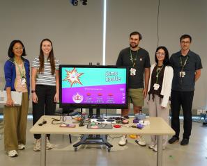 clinical team poses with adaptive gaming devices