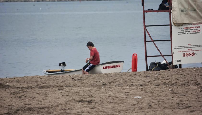 Ben sitting on the side of the lifeguard boat