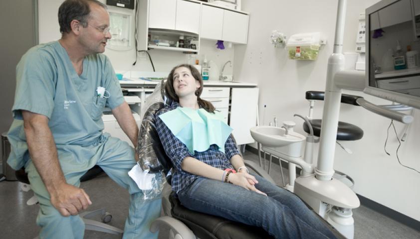 Dr. Robert Carmichael talking with a client