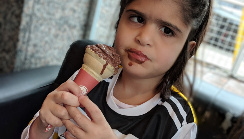 Lilly enjoying a chocolate ice cream cone