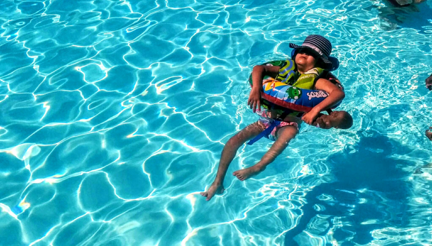 Lilly floating in a pool