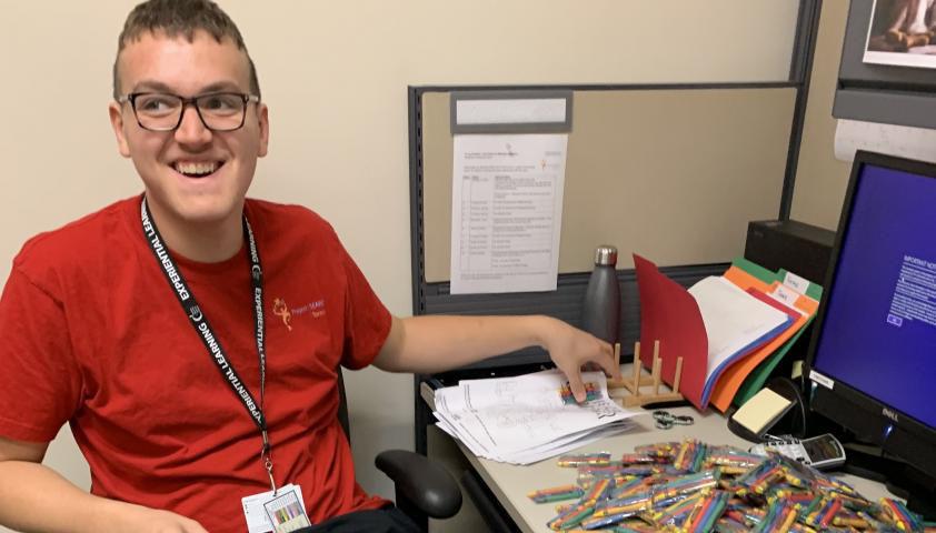 Andrew at work at his desk. 