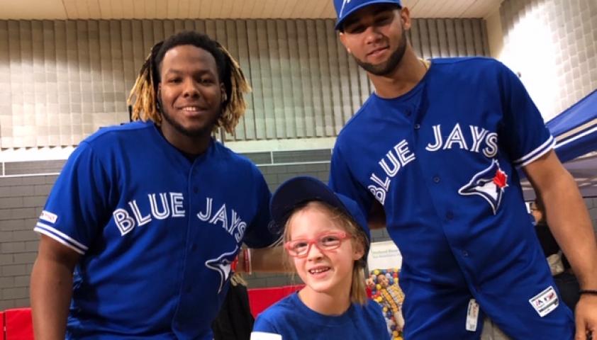 Olivia posing with the Toronto Blue Jays