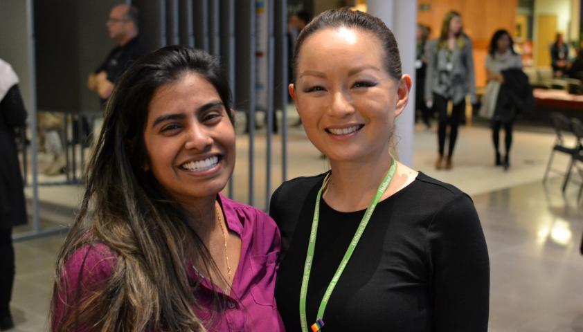 Jeannie Fong, research operations assistant, and Shalini Rajeshwaran, human resources and trainee coordinator, looking relaxed after a successful morning of presentations.